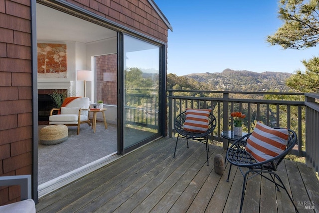 wooden deck with a mountain view