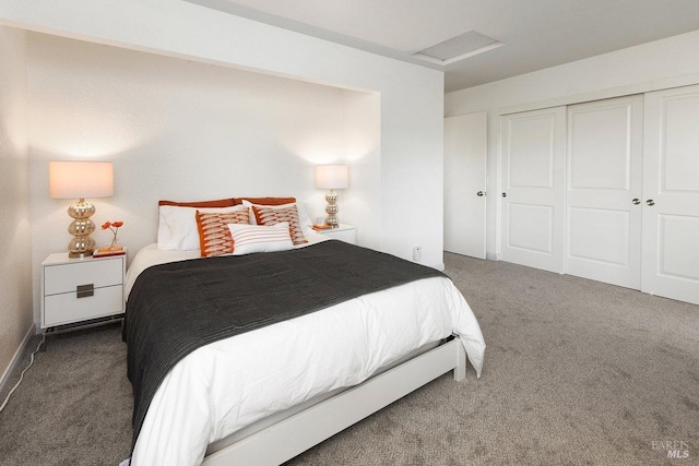 bedroom with a closet and dark colored carpet