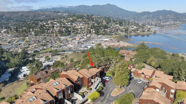 aerial view featuring a water and mountain view