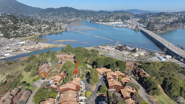 aerial view featuring a water and mountain view