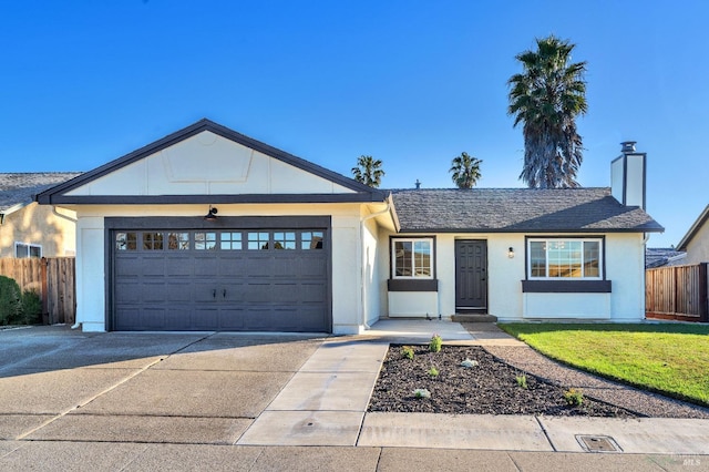 ranch-style house featuring a garage and a front yard