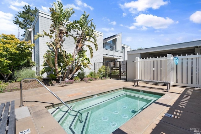 view of pool with a community hot tub