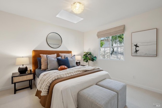 carpeted bedroom with a skylight