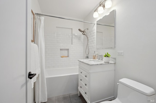 full bathroom with shower / bath combination with curtain, vanity, and toilet