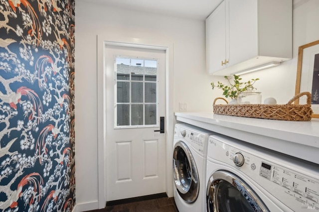 clothes washing area featuring dark hardwood / wood-style floors, cabinets, and washing machine and clothes dryer