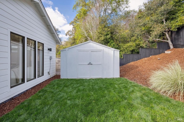 view of outbuilding with a yard