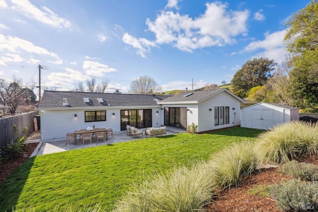 rear view of house featuring a storage shed, an outdoor hangout area, a patio, and a lawn