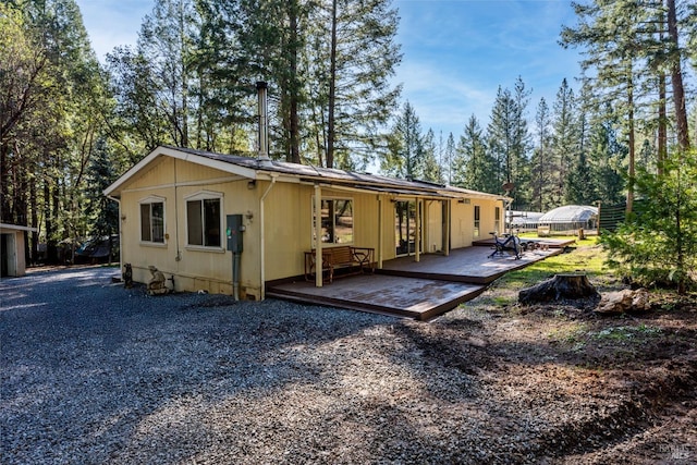 view of front of house featuring a wooden deck