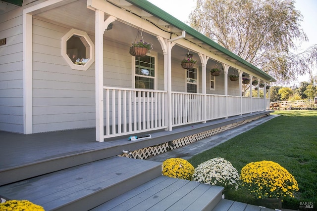 exterior space featuring a yard and a porch