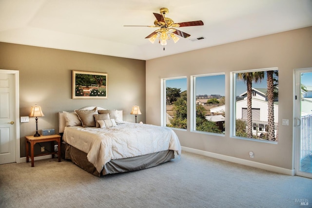 bedroom with visible vents, a ceiling fan, access to outside, baseboards, and light colored carpet