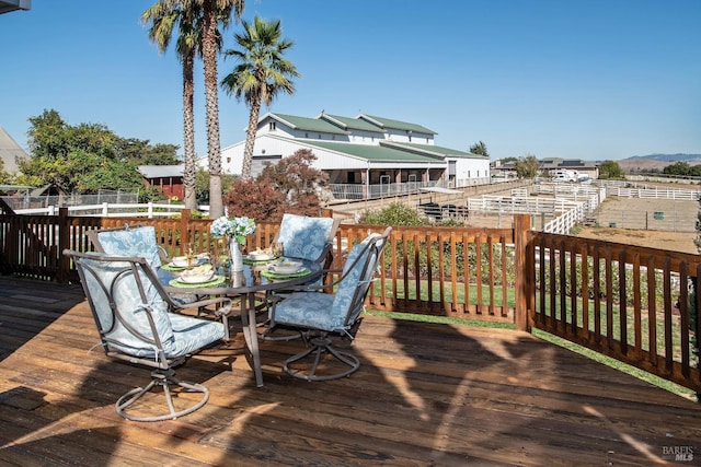 deck with outdoor dining area