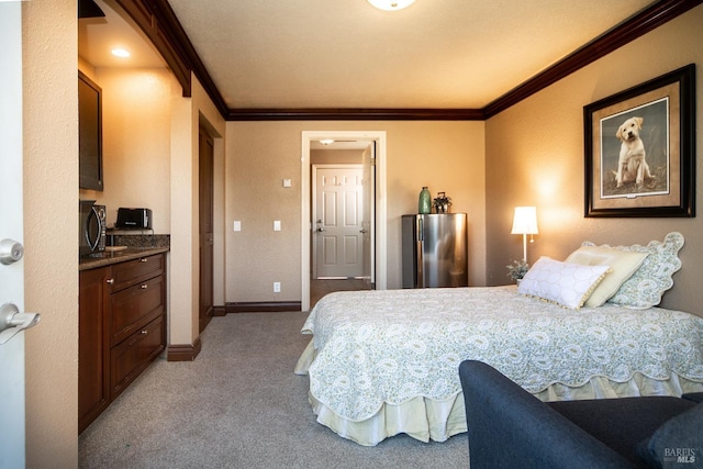 bedroom with light colored carpet, baseboards, freestanding refrigerator, and ornamental molding