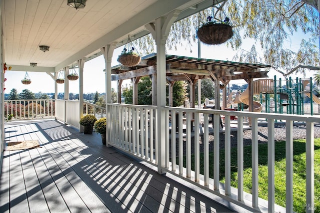 wooden terrace with a playground