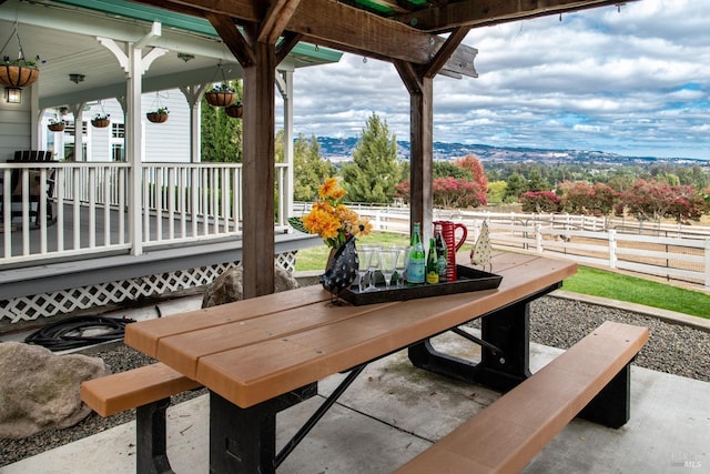 view of patio / terrace featuring outdoor dining space and fence