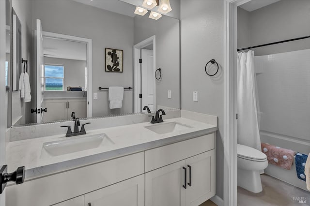 bathroom with vanity, toilet, and a shower with shower curtain