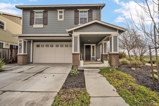 view of front of property with a garage and covered porch