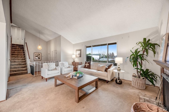 living room with vaulted ceiling, carpet, and a textured ceiling