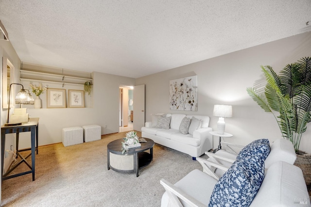 carpeted living room with a textured ceiling