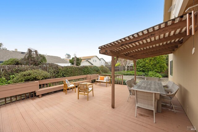 deck with a pergola and outdoor lounge area