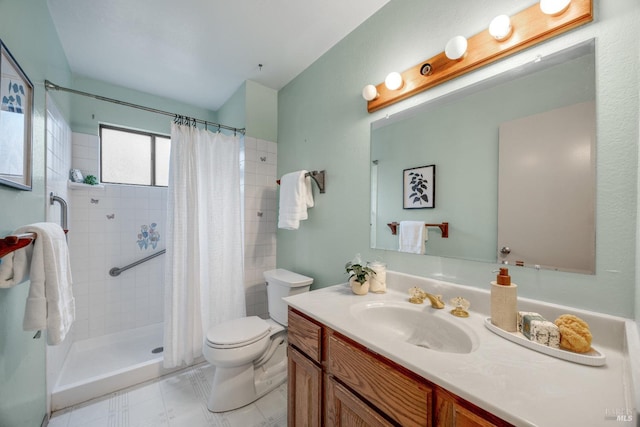 bathroom with vanity, curtained shower, and toilet