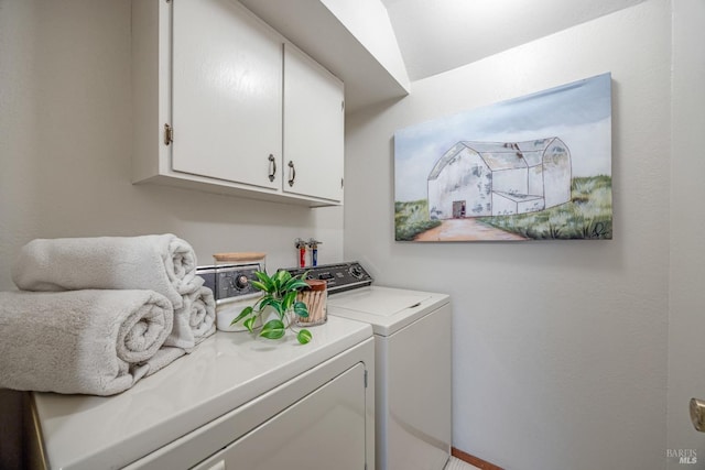 laundry area featuring cabinets and washer and dryer