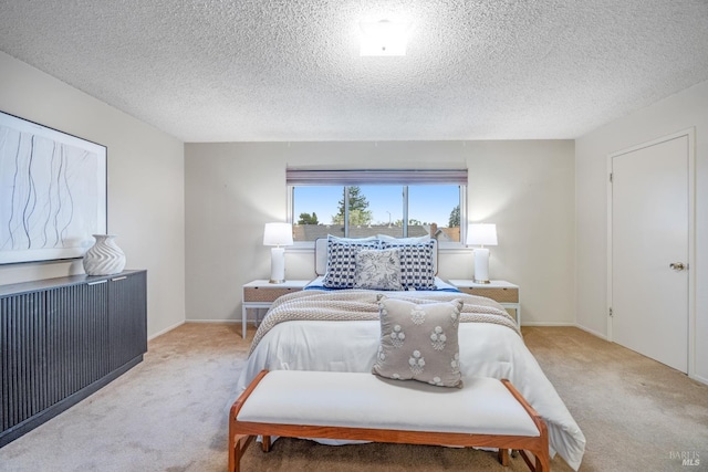 carpeted bedroom featuring a textured ceiling