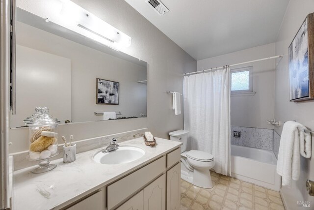 full bathroom with vanity, shower / bath combination with curtain, and toilet