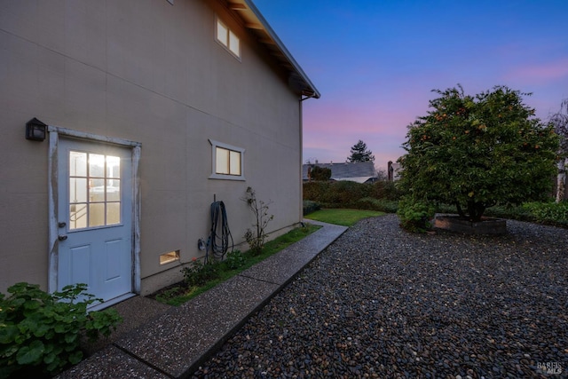 view of property exterior at dusk