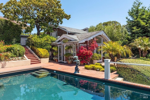 view of pool featuring a patio