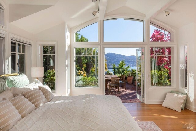 view of patio / terrace featuring a water and mountain view