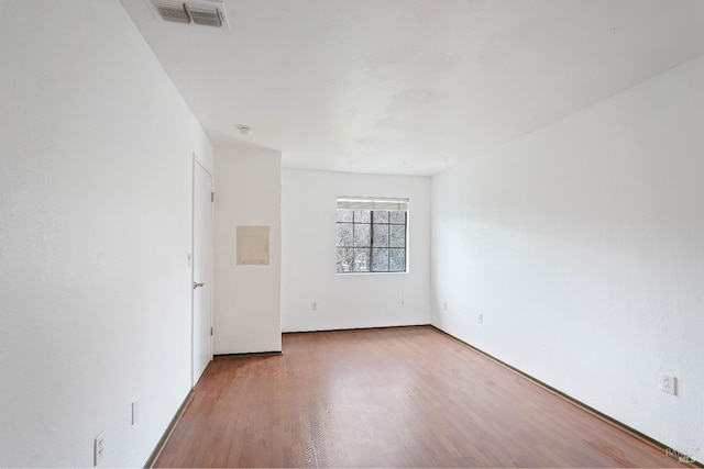 unfurnished room featuring wood-type flooring