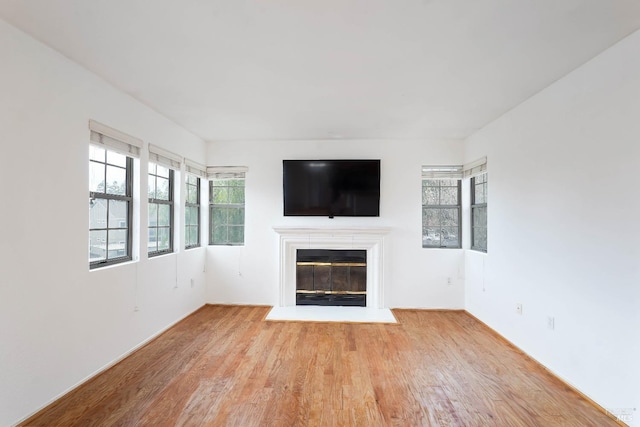 unfurnished living room featuring light wood-type flooring