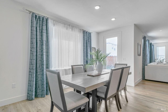 dining room with light wood-type flooring