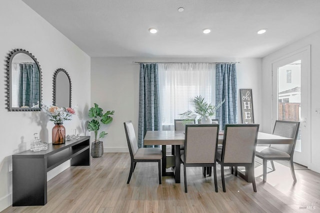 dining room with light hardwood / wood-style floors