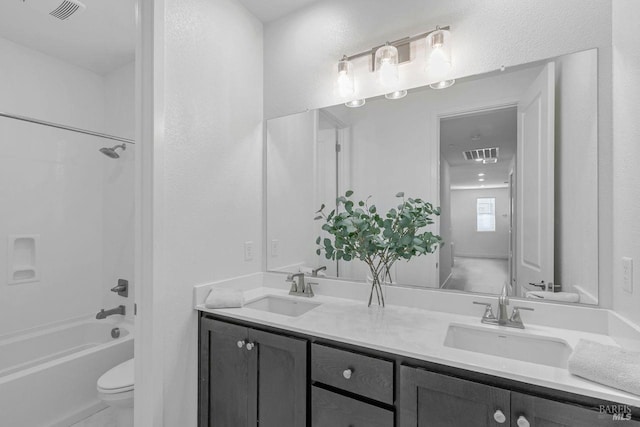 full bathroom featuring shower / bathtub combination, vanity, and toilet