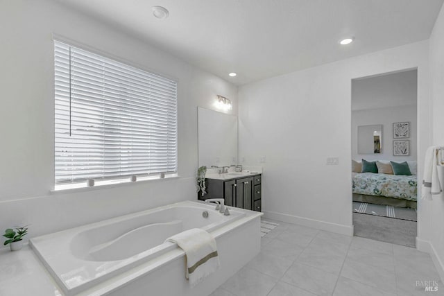 bathroom with vanity, a bath, and tile patterned flooring