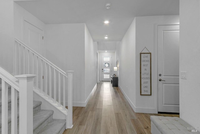 hall with light hardwood / wood-style floors