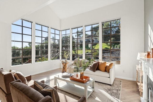 sunroom / solarium with vaulted ceiling