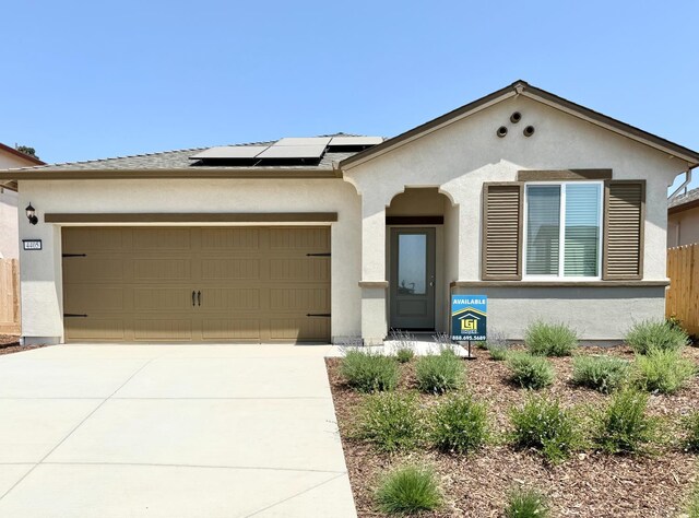 4405 Amble Ln, Riverbank, CA 95367 - view of front of property featuring stucco siding, an attached garage, concrete driveway, and roof with shingles