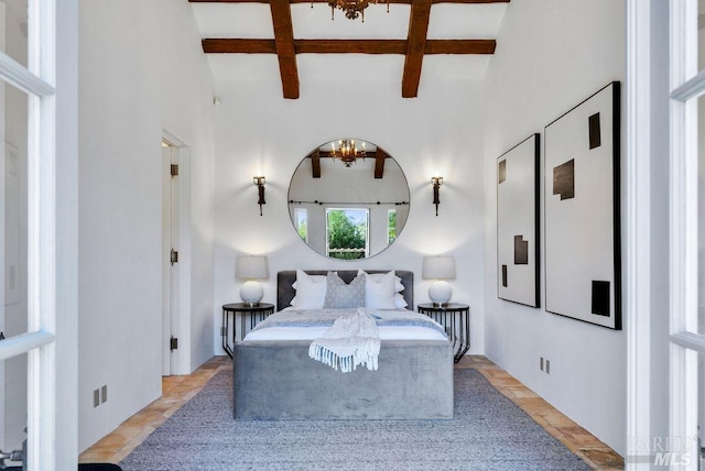bedroom with beamed ceiling and coffered ceiling
