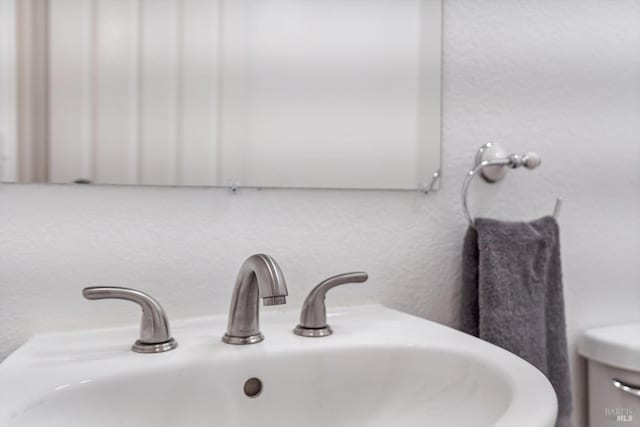 bathroom featuring toilet and sink