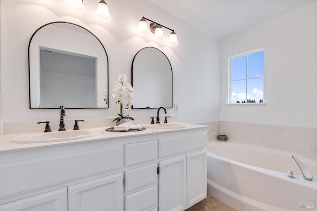 bathroom featuring vanity and a tub