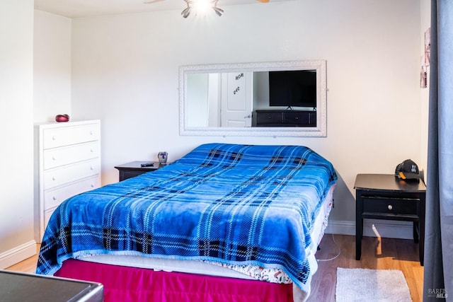 bedroom with hardwood / wood-style floors