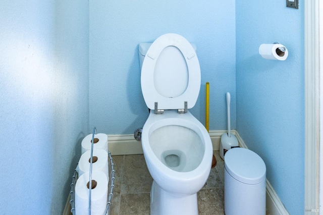 bathroom with tile patterned floors and toilet