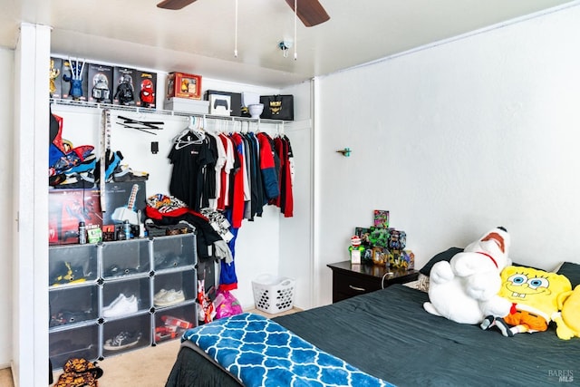 bedroom with carpet floors, ceiling fan, and a closet