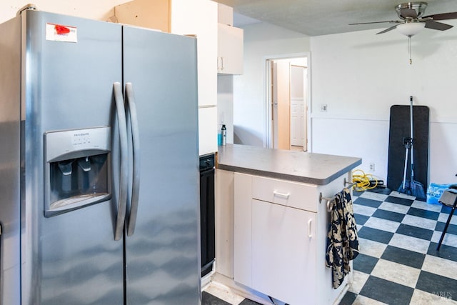 kitchen with stainless steel fridge with ice dispenser, kitchen peninsula, white cabinets, and ceiling fan