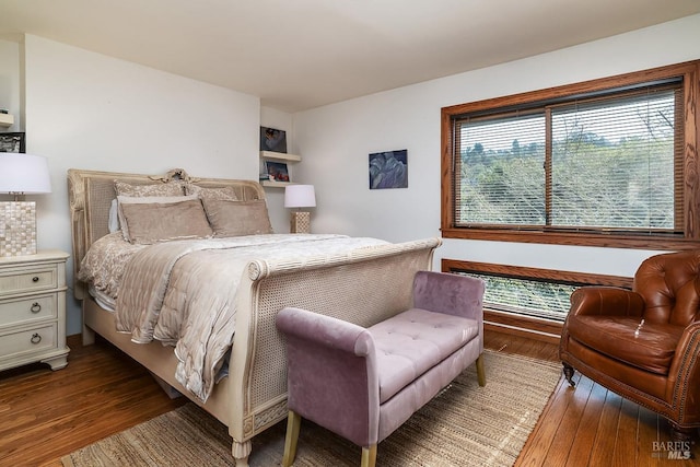 bedroom with hardwood / wood-style floors