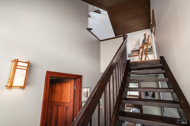 staircase featuring a high ceiling