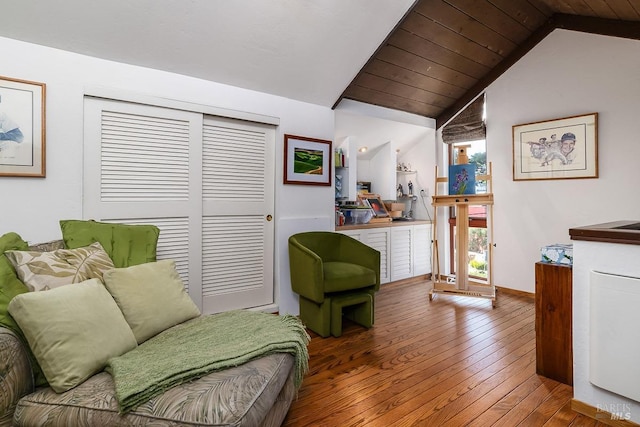 living area with wooden ceiling, baseboards, vaulted ceiling, and hardwood / wood-style floors