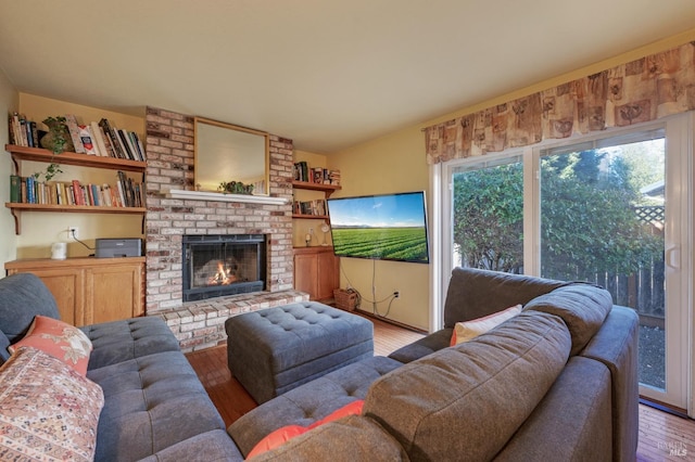 living room featuring a fireplace and wood finished floors